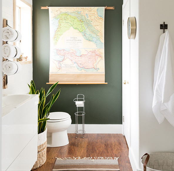 Redefine your bathtub space by accenting the walls with a fresh new backdrop to bring a pop of color into a small bathroom.