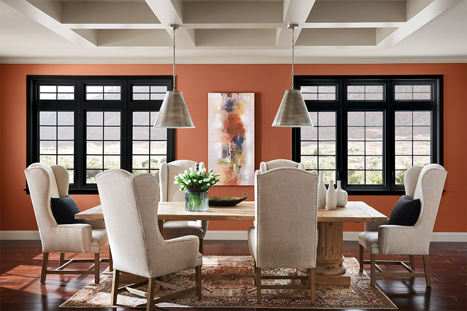 Sherwin-Williams Cavern Clay SW 7701 is on the dining room wall